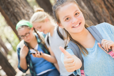 Three Young Girl Friends together at the Parkの写真素材