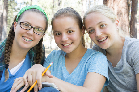 Young Girls Studying at the Parkの写真素材