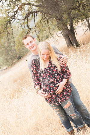 Portrait of a Happy Pregnant Wife With Her Husband in the Outdoorsの写真素材