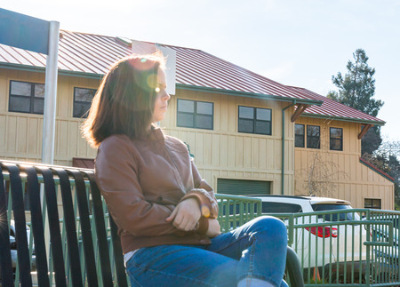 Cute Young Girl Sitting Near Train Railsの写真素材