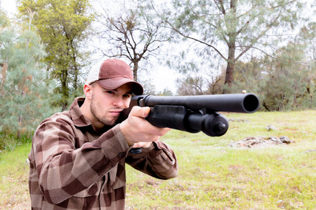 Young Man Hunting With Shotgun