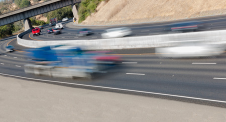 Many Vehicles in Motion on Three Lane Highwayの写真素材