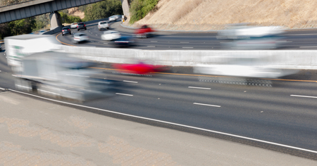 Many Vehicles in Motion on Three Lane Highwayの写真素材