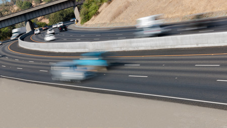 Many Vehicles in Motion on Three Lane Highwayの写真素材