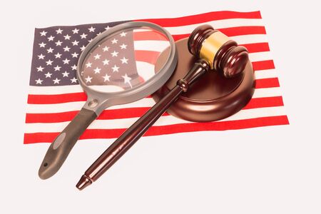 Large Magnifying Glass and Judges Gavel on The American Flagの写真素材
