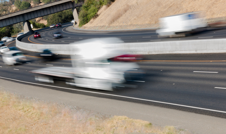 Many Vehicles in Motion on Three Lane Highwayの写真素材