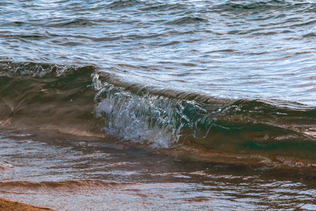 Waves of Water and Splashes on the Lake Shorelineの写真素材