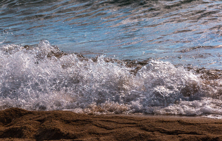 Waves of Water and Splashes on the Lake Shorelineの写真素材