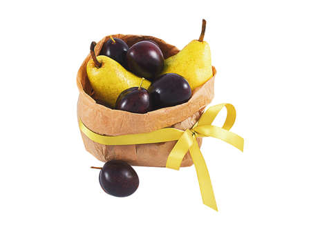 Grocery bag with pears and plums isolated on whiteの写真素材