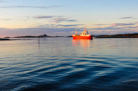 Ship in Traena, Norway, with picturesque view in the backgroundの写真素材