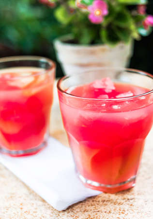 Watermelon lemonade in two glasses on table