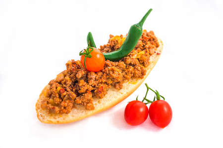 Sandwich with minced meat mexican style with vegetables isolated on whiteの写真素材