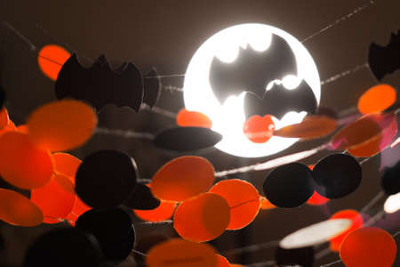 Halloween paper garlands on dark backgroundの写真素材