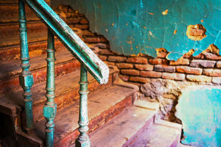 Old stairs and handrail with brick wall on backgroundの写真素材