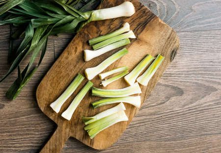 Chopped leek on wooden boardの写真素材