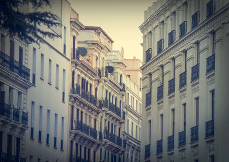 Mediterranean architecture in Spain. Old apartment building in Madrid. Toned in vintage colorsの写真素材