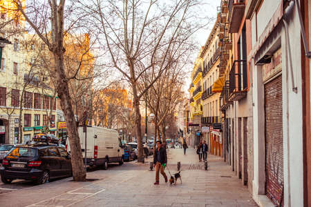 MADRID, SPAIN - MARCH 12: Old narrow street with pedestrians in March 12, 2014 in Madrid, Spain. It is old centre of capital cityのeditorial素材