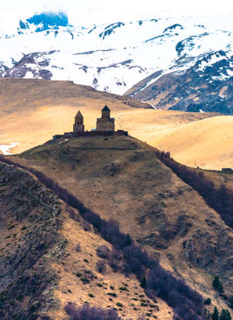 Mount Kazbek and Gergeti church in Georgiaの写真素材