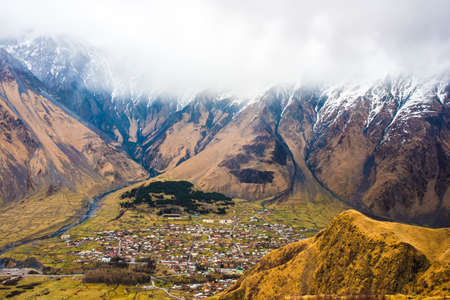 Stepantsminda village in Caucasus mountains near mount Kazbek (Kazbegi), Georgiaの写真素材