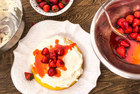 Preparation of the strawberry cake with whipped creamの写真素材