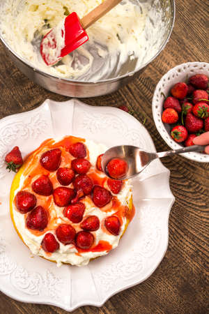 Preparation of the strawberry cake with whipped creamの写真素材