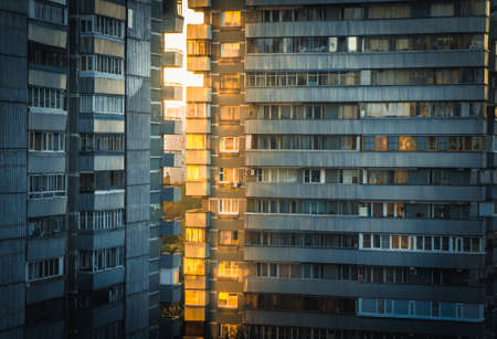 Sun shining through apartment buildings  at sunset on the outskirts of Moscow, Russiaのeditorial素材