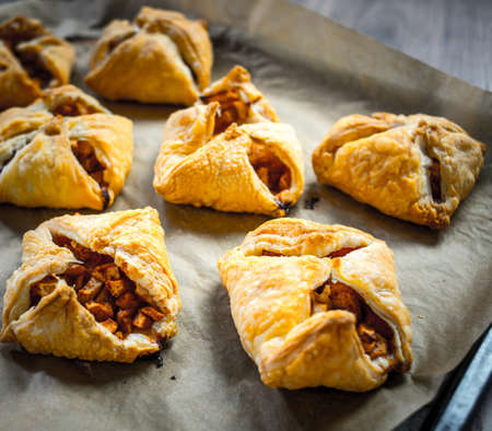 Delicious homemade apple strudel on wooden backgroundの写真素材