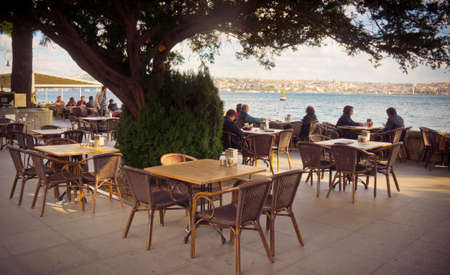 ISTANBUL, TURKEY -october 23, 2014: Street cafe on the coast of Bosphorus in Istanbul, Turkey. Toned image.のeditorial素材