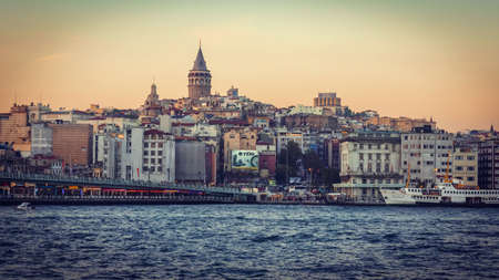 ISTANBUL, TURKEY - OCTOBER 24, 2014 : View on Galata Tower and Istanbul landscape in sunset  in Istanbul, Turkey. Toned image.のeditorial素材
