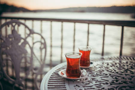 Turkish tea is served in a cafe with Bosphorus view in Istanbul, Turkey.の写真素材