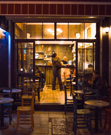 ISTANBUL, TURKEY -  october 26, 2014: Customer drinks evening tea in a cafe in Kadikoy in Istanbul, Turkey.のeditorial素材