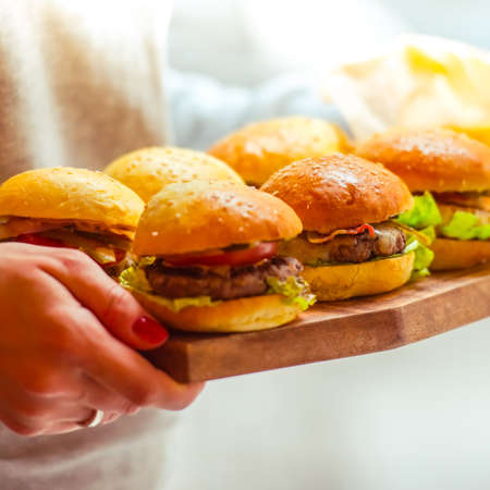 Party set of different burgers on wooden boardの写真素材