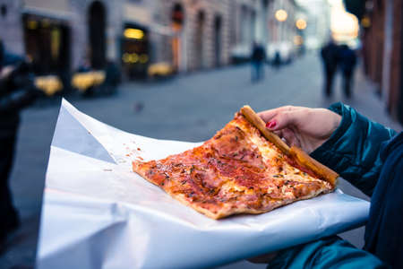 Freshly baked traditional savoury Italian pizza as a street foodの写真素材