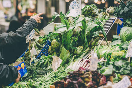 GENOA, ITALY - FEBRUARY 23, 2015: Fresh fruits and vegetables for sale in Mercato Orientale, famous market in central Genoa. Toned imageのeditorial素材