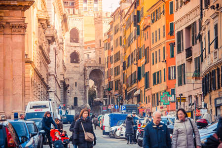 GENOA, ITALY - FEBRUARY 27, 2015: Tourists and locals walk at old city centre of Genoa, Italyのeditorial素材