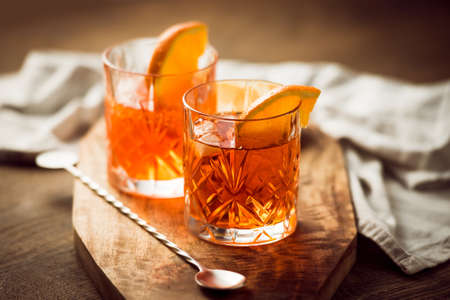 Two glasses of cocktail with orange sliceの写真素材