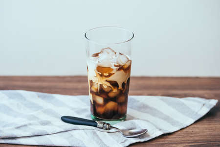 Ice coffee with cream in glassの写真素材