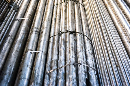 Stacked aluminum metal pipes. Heavy industry productionの写真素材