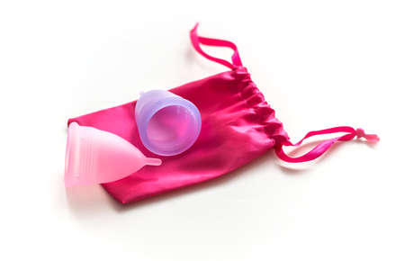 Two menstrual cups with cotton bag isolated on white backgroundの写真素材