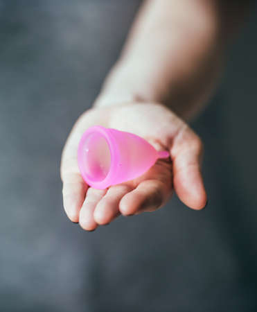 Young woman hand holding menstrual cupの写真素材