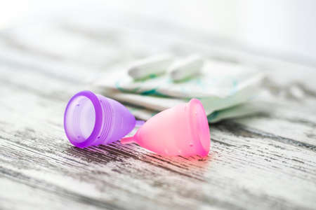 Different types of feminine hygiene products - menstrual cups, sanitary pads and tamponsの写真素材