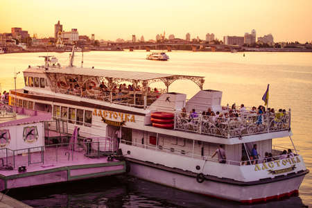 KIEV (KYIV), UKRAINE - MAY 25, 2015: Tourist boat on the Drepr (Dnieper) river in Kiev, Ukraine. Toned imageのeditorial素材