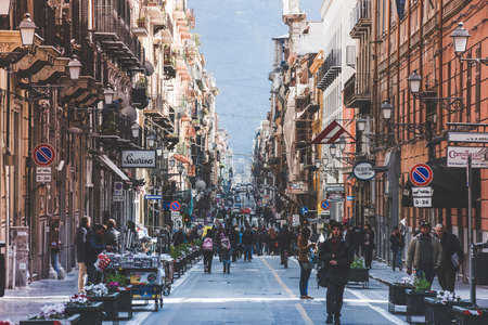 PALERMO, ITALY - MARCH 14, 2015: Pedestrians walking by via Maqueda, famous street in old city centre of Palermo, Italy. Toned pictureのeditorial素材