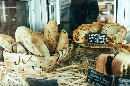 NAPLES, ITALY - MARCH 20, 2015: Bakery shop with traditional neapolitan bread in the old center of Naples, Italy.のeditorial素材