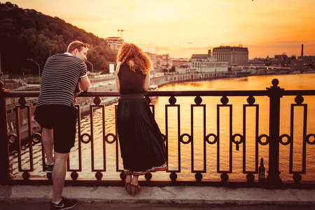 KIEV (KYIV), UKRAINE - MAY 25, 2015: Young couple standing on bridge over the Dnepr (Dnieper) river in Kiev, Ukraineのeditorial素材