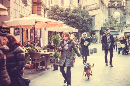 NAPLES, ITALY - MARCH 20, 2015: People walking through the old street  in the historical center of Naples, Italy. Toned pictureのeditorial素材