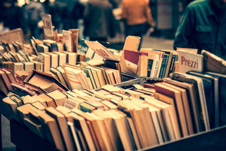 NAPLES, ITALY - MARCH 20, 2015: Second hand book stalls of the book market in the historical center of Naples, Italy. Toned pictureのeditorial素材