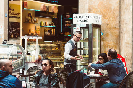NAPLES, ITALY - MARCH 20, 2015: People eating at small cafe in Galeria Umberto I in Naples, Italyのeditorial素材
