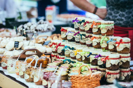 KIEV (KYIV), UKRAINE - MAY 26, 2015: Jars with different jams and marmalades on a food market in Kiev, Ukraineのeditorial素材