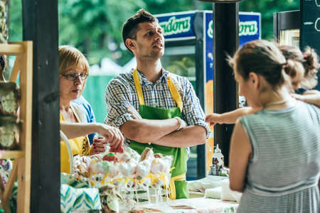 KIEV (KYIV), UKRAINE - MAY 26, 2015: Vendors on a pop-up food market in Kiev, Ukraineのeditorial素材